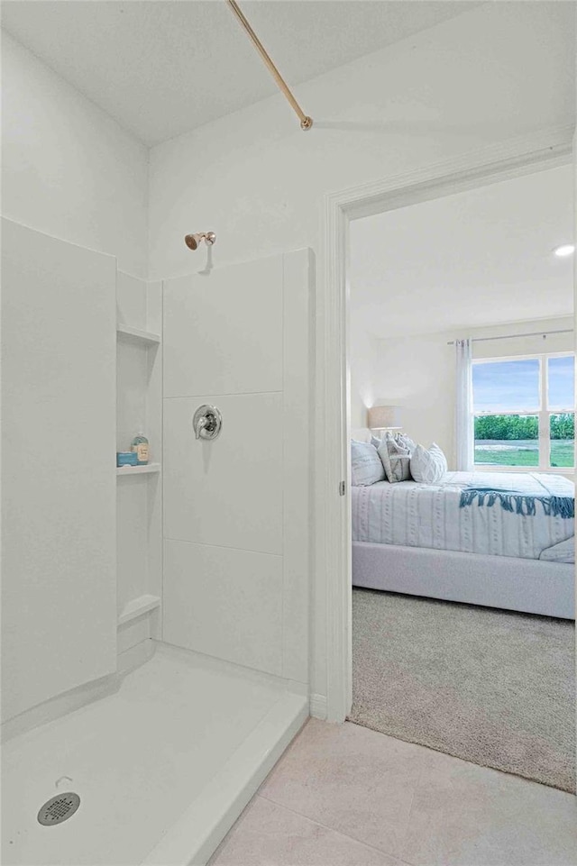 bathroom featuring tile patterned flooring and walk in shower