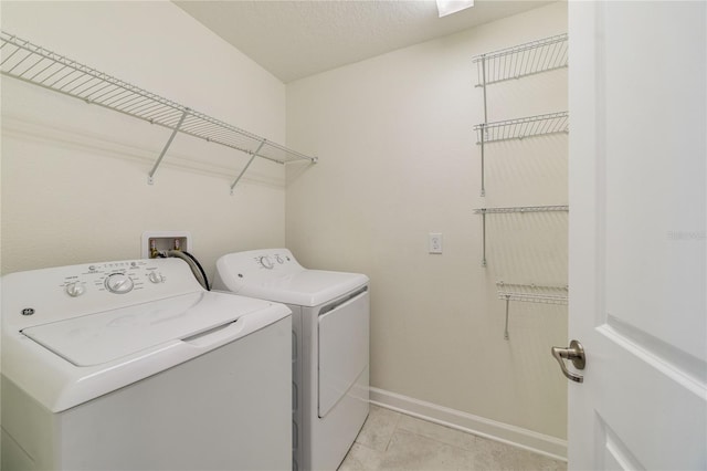 15088 Night Heron Dr, Winter Garden, FL 34787 - laundry room with washing machine and clothes dryer and light tile patterned flooring