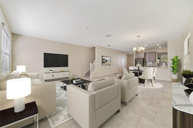 15088 Night Heron Dr, Winter Garden, FL 34787 - living room with stairs, a chandelier, and recessed lighting