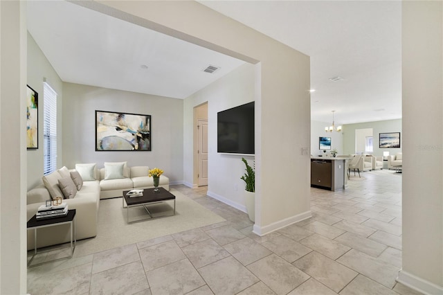 15088 Night Heron Dr, Winter Garden, FL 34787 - living area with a chandelier and baseboards