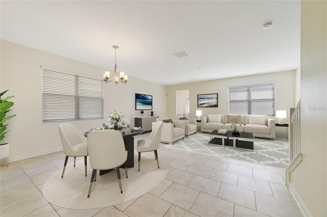 15088 Night Heron Dr, Winter Garden, FL 34787 - dining room with a chandelier and light tile patterned floors