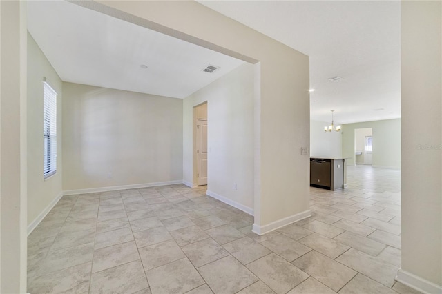 15088 Night Heron Dr, Winter Garden, FL 34787 - empty room with a chandelier and light tile patterned floors
