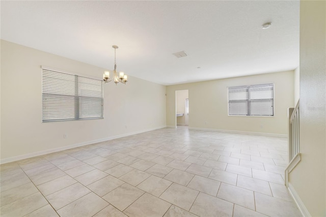 15088 Night Heron Dr, Winter Garden, FL 34787 - unfurnished room with a chandelier, light tile patterned floors, and a smoke detector