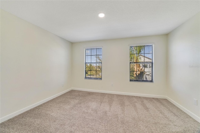 15088 Night Heron Dr, Winter Garden, FL 34787 - spare room with carpet, plenty of natural light, and recessed lighting