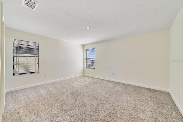 15088 Night Heron Dr, Winter Garden, FL 34787 - carpeted empty room with baseboards and a textured ceiling
