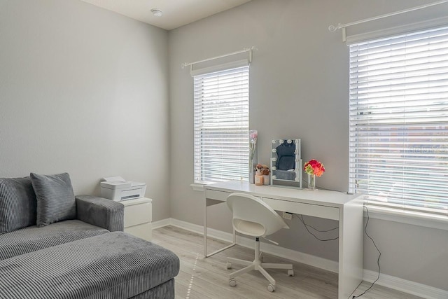 office featuring light wood-style flooring and baseboards