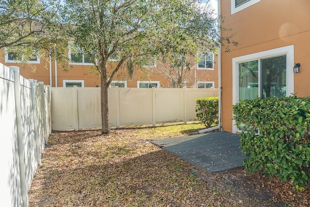 view of yard with a fenced backyard