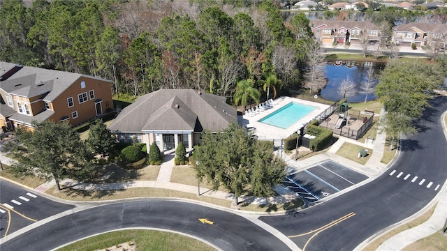 bird's eye view featuring a residential view and a water view