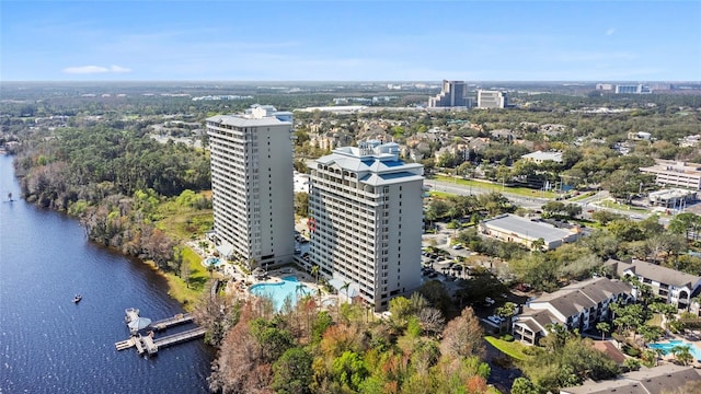 birds eye view of property with a view of city and a water view