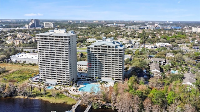 birds eye view of property featuring a water view and a view of city