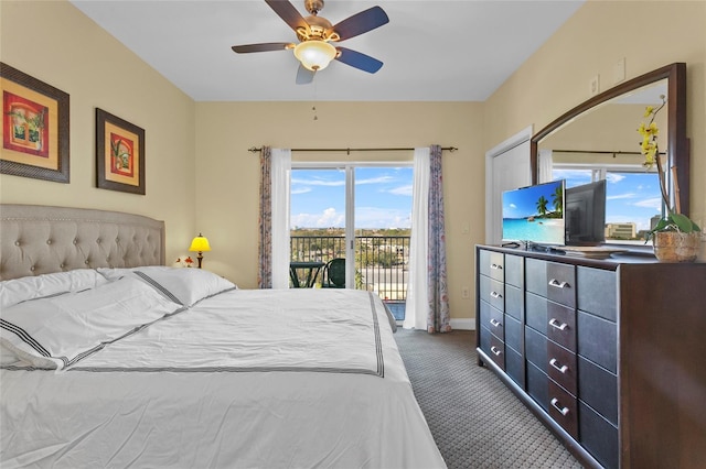 carpeted bedroom featuring access to outside, baseboards, and ceiling fan