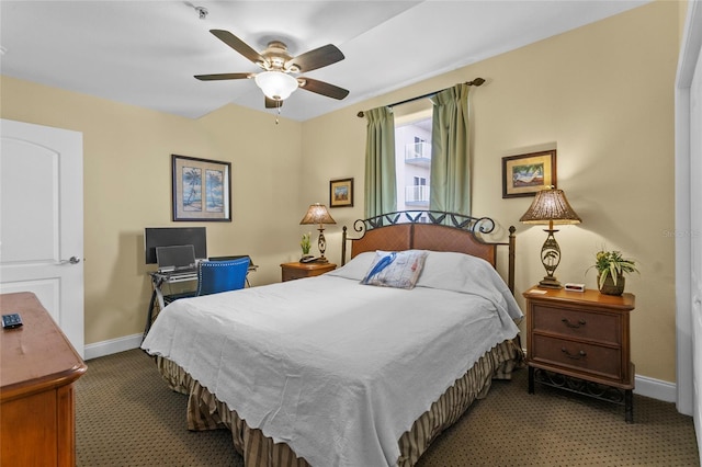 carpeted bedroom featuring ceiling fan and baseboards