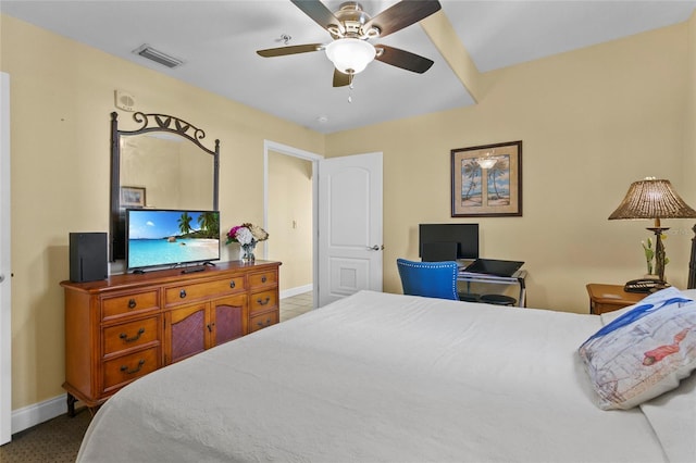 bedroom with baseboards, visible vents, and a ceiling fan