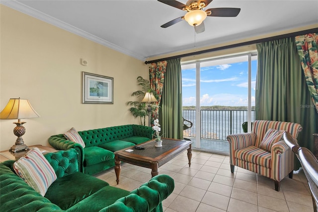 living room featuring ornamental molding, a water view, ceiling fan, and light tile patterned floors