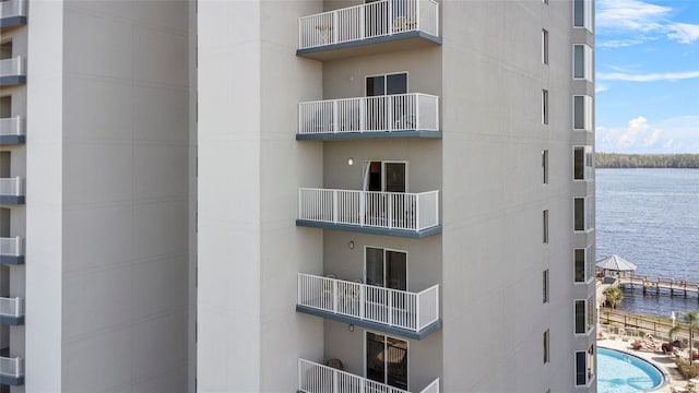 view of building exterior with a water view