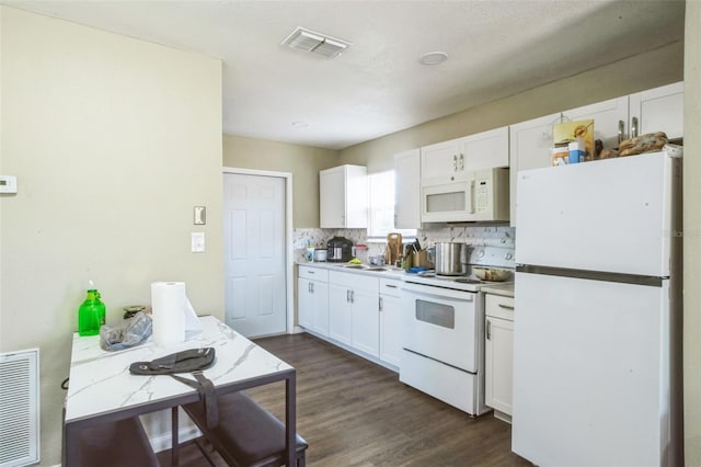 kitchen featuring visible vents, white appliances, dark wood-style flooring, and white cabinetry