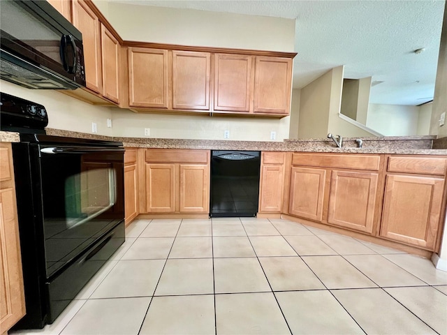6640 S Goldenrod Rd Unit 118B, Orlando, FL 32822 - kitchen featuring black appliances and light tile patterned floors
