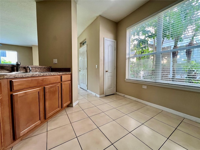 6640 S Goldenrod Rd Unit 118B, Orlando, FL 32822 - bathroom featuring vanity, tile patterned floors, and baseboards