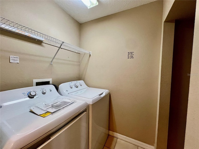 6640 S Goldenrod Rd Unit 118B, Orlando, FL 32822 - laundry room with separate washer and dryer, light tile patterned flooring, and baseboards