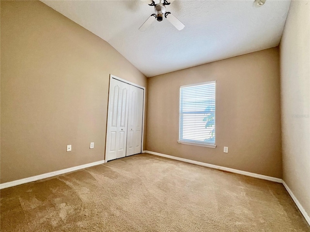 6640 S Goldenrod Rd Unit 118B, Orlando, FL 32822 - unfurnished bedroom featuring lofted ceiling, carpet flooring, baseboards, a closet, and a ceiling fan