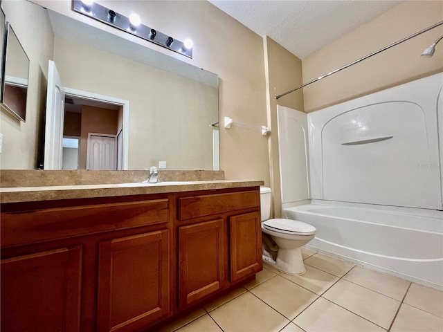6640 S Goldenrod Rd Unit 118B, Orlando, FL 32822 - full bath featuring tile patterned floors, toilet, bathtub / shower combination, vanity, and a textured ceiling
