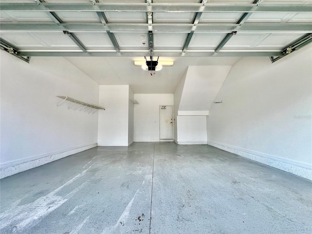 6640 S Goldenrod Rd Unit 118B, Orlando, FL 32822 - garage with a garage door opener and baseboards
