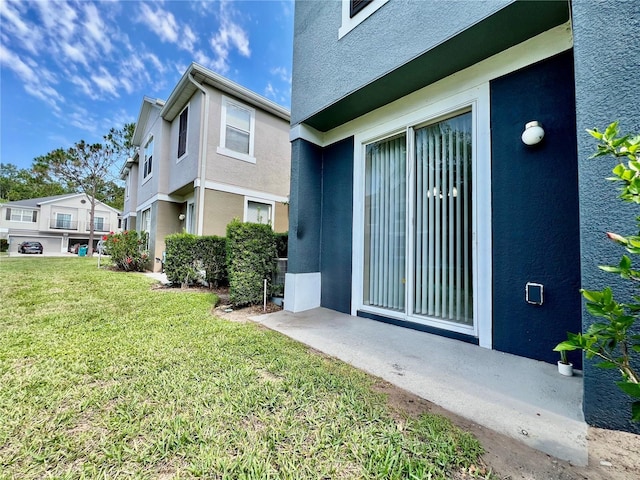 6640 S Goldenrod Rd Unit 118B, Orlando, FL 32822 - property entrance with a yard and stucco siding