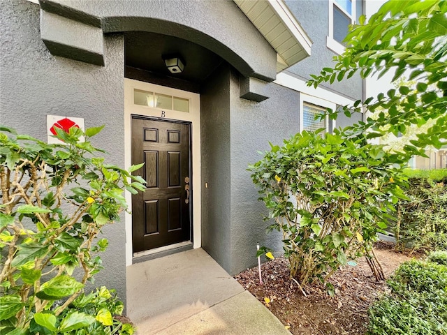6640 S Goldenrod Rd Unit 118B, Orlando, FL 32822 - property entrance featuring stucco siding and a surveillance system