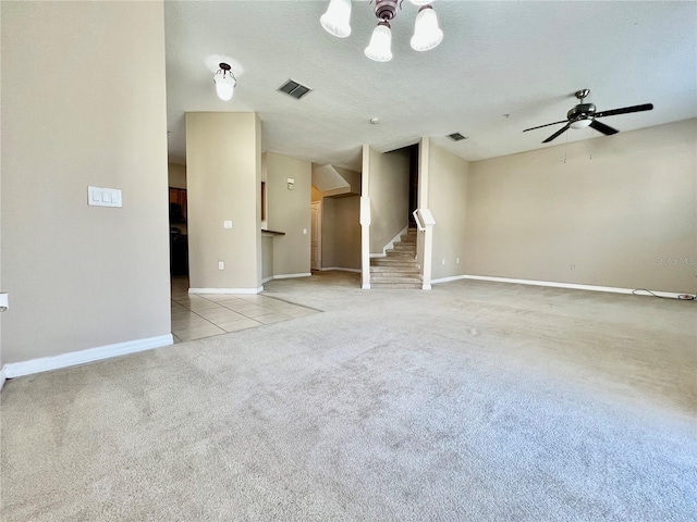 6640 S Goldenrod Rd Unit 118B, Orlando, FL 32822 - unfurnished living room featuring stairway, light carpet, baseboards, a chandelier, and a ceiling fan