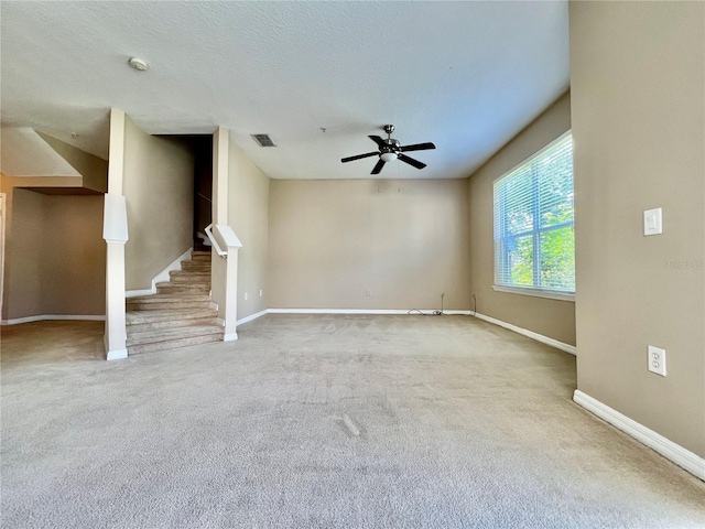 6640 S Goldenrod Rd Unit 118B, Orlando, FL 32822 - unfurnished living room with carpet, baseboards, a ceiling fan, and stairway