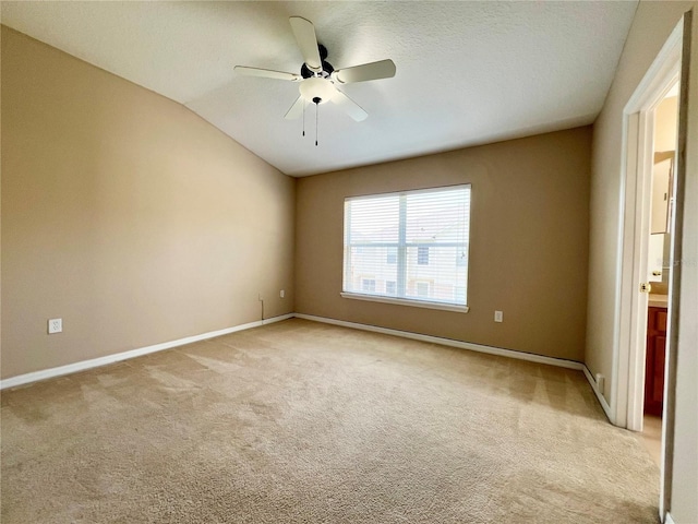6640 S Goldenrod Rd Unit 118B, Orlando, FL 32822 - empty room featuring light carpet, baseboards, a ceiling fan, and vaulted ceiling