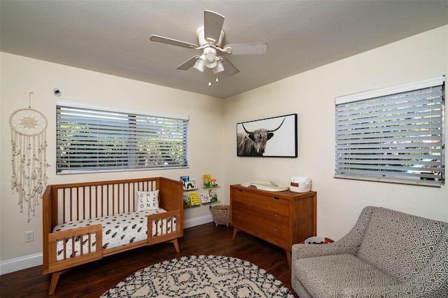 bedroom featuring ceiling fan and dark hardwood / wood-style floors