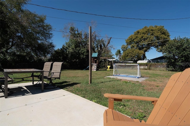 view of yard with a patio and a playground