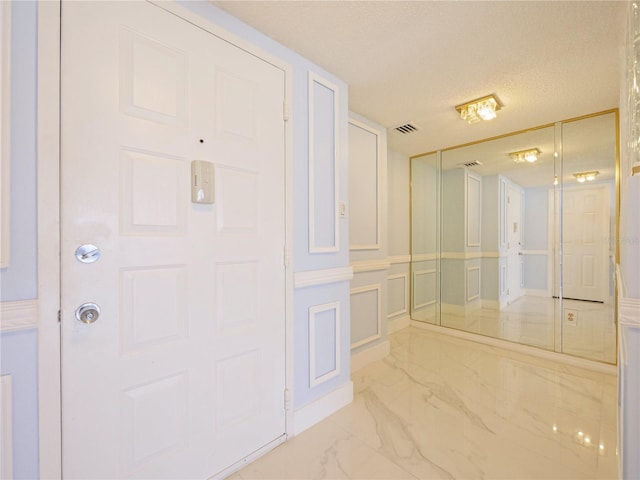 bathroom featuring a textured ceiling