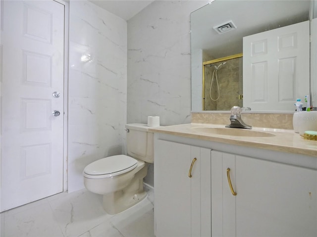 bathroom with tile walls, vanity, toilet, and walk in shower