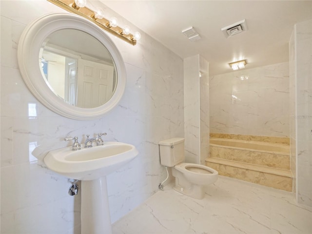 bathroom featuring toilet and a bathing tub