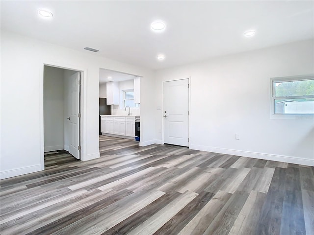 4502 Florence St, Apopka, FL 32712 - unfurnished room featuring sink and hardwood / wood-style floors