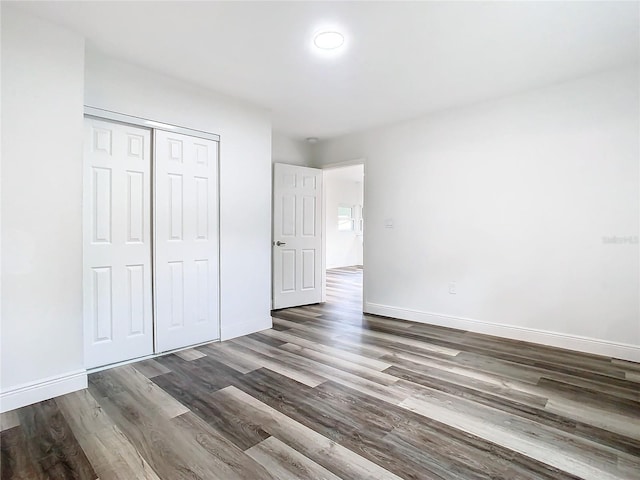 4502 Florence St, Apopka, FL 32712 - unfurnished bedroom featuring dark hardwood / wood-style floors and a closet