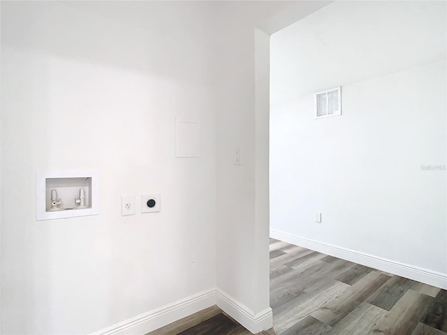 4502 Florence St, Apopka, FL 32712 - laundry room featuring washer hookup, electric dryer hookup, and hardwood / wood-style floors