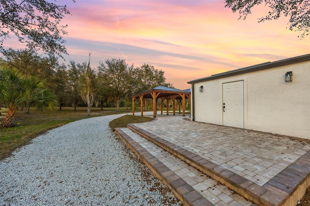 exterior space featuring a patio and a gazebo