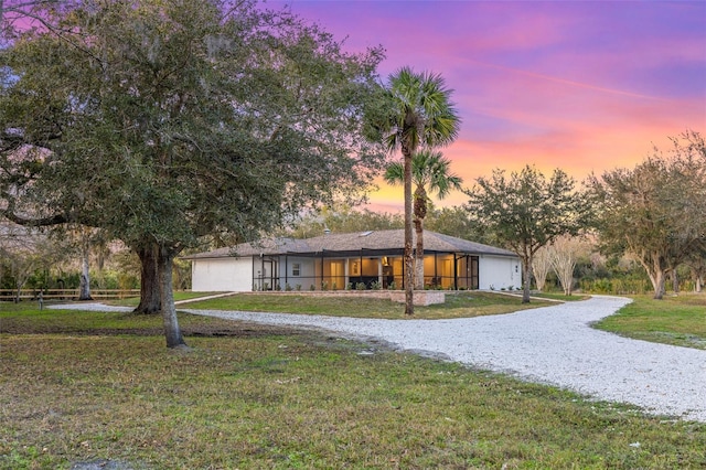 view of front of home featuring a lawn