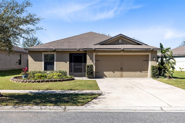 ranch-style house featuring a front lawn and a garage