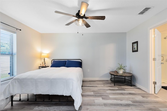 bedroom with light hardwood / wood-style floors and ceiling fan