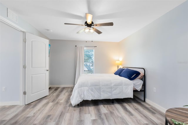 bedroom featuring light wood-type flooring and ceiling fan