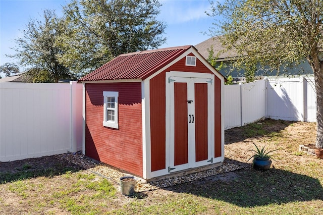 view of outdoor structure with a lawn