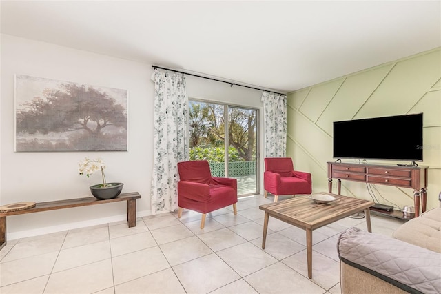 living area with baseboards and light tile patterned flooring