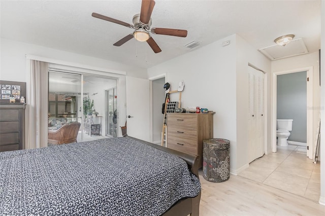 bedroom with attic access, visible vents, ceiling fan, a textured ceiling, and light wood-style floors