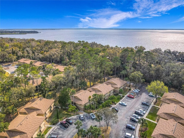 birds eye view of property with a water view and a residential view