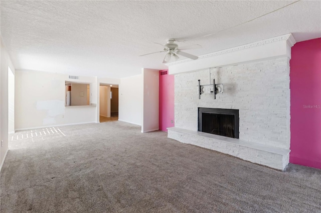 unfurnished living room with a fireplace, a textured ceiling, carpet, and ceiling fan