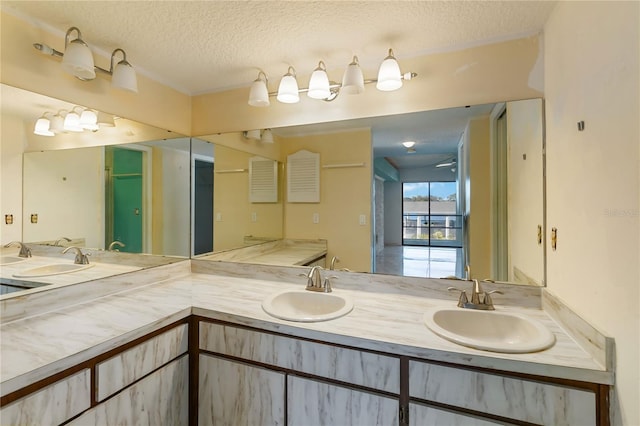 bathroom featuring vanity and a textured ceiling